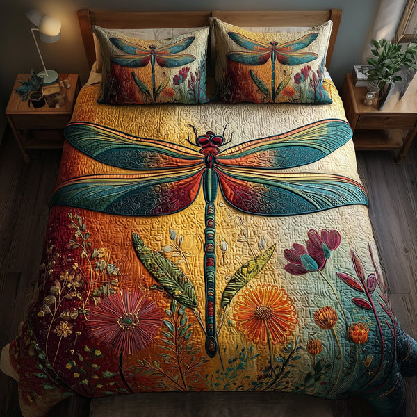 Dragonfly Serenity quilted 3-piece bedding set on a made bed with two matching pillow shams