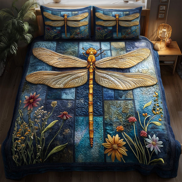 Dragonfly Serenity quilted 3-piece bedding set on a made bed with two matching pillow shams