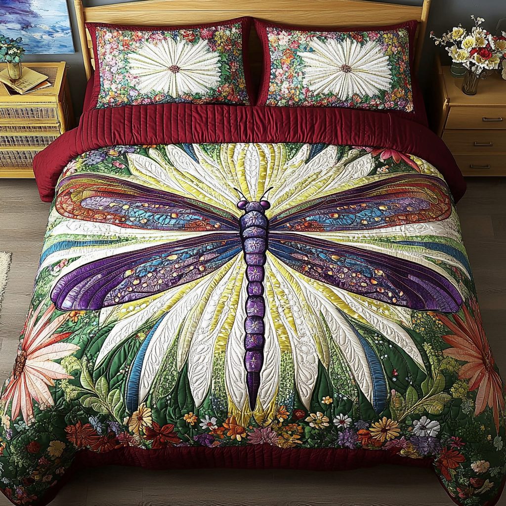 Dragonfly Symphony quilted 3-piece bedding set on a made bed with two matching pillow shams