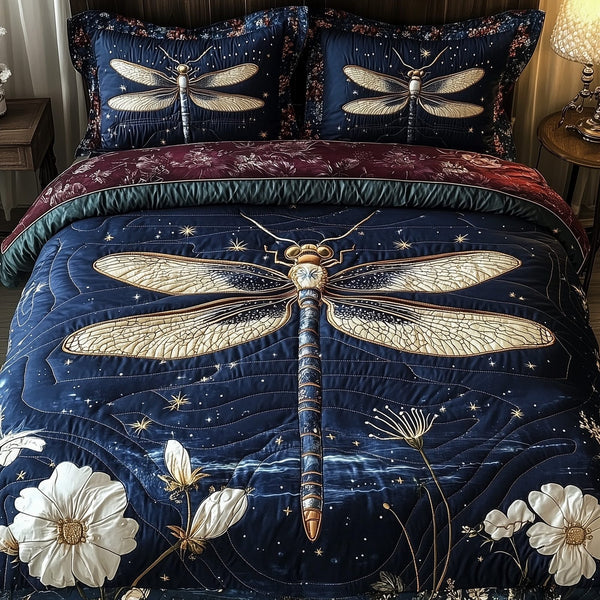 Dragonfly Whisper quilted 3-piece bedding set on a made bed with two matching pillow shams
