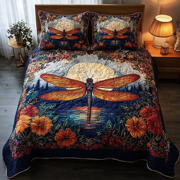 Dragonfly Whisper quilted 3-piece bedding set on a made bed with two matching pillow shams