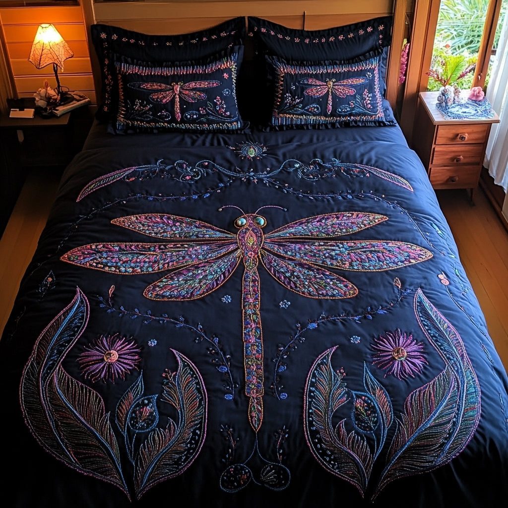 Dragonfly Whisper quilted 3-piece bedding set on a made bed with two matching pillow shams