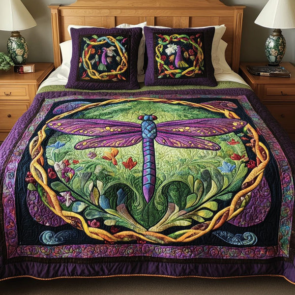 Dragonfly Whispers quilted 3-piece bedding set on a made bed with two matching pillow shams