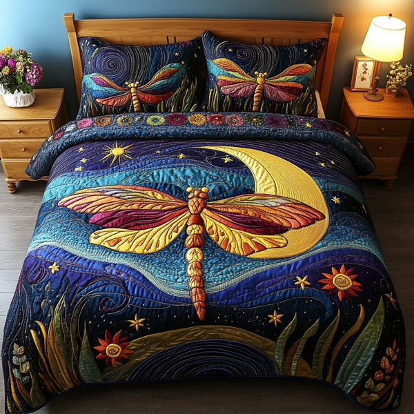 Dragonfly Wings quilted 3-piece bedding set on a made bed with two matching pillow shams