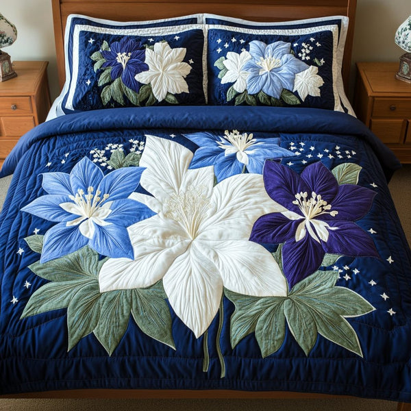 Dream Blossom quilted 3-piece bedding set on a made bed with two matching pillow shams