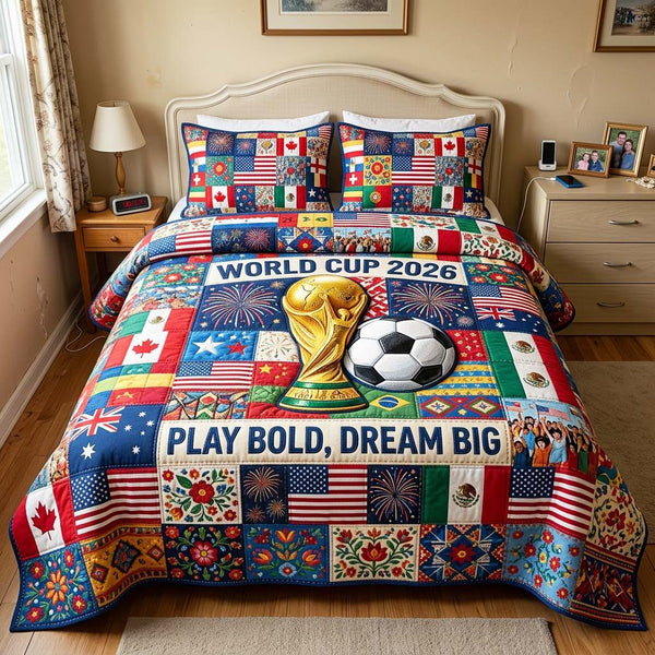 Dream Victory quilted 3-piece bedding set on a made bed with two matching pillow shams