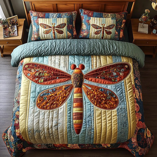 Dream Wings quilted 3-piece bedding set on a made bed with two matching pillow shams