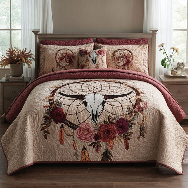 Dreamcatcher Bloom quilted 3-piece bedding set on a made bed with two matching pillow shams