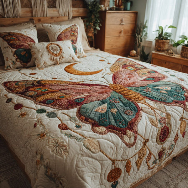 Dreamcatcher Wings quilted 3-piece bedding set on a made bed with two matching pillow shams