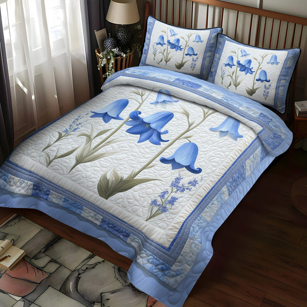 Dreaming Flowers quilted 3-piece bedding set on a made bed with two matching pillow shams