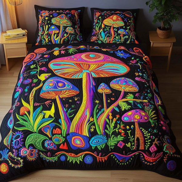 Dreamscape Glow quilted 3-piece bedding set on a made bed with two matching pillow shams