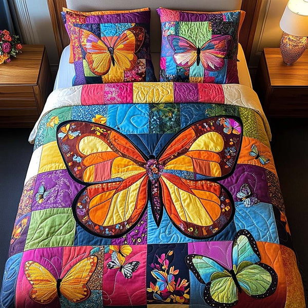Dreamy Butterfly Flight quilted 3-piece bedding set on a made bed with two matching pillow shams