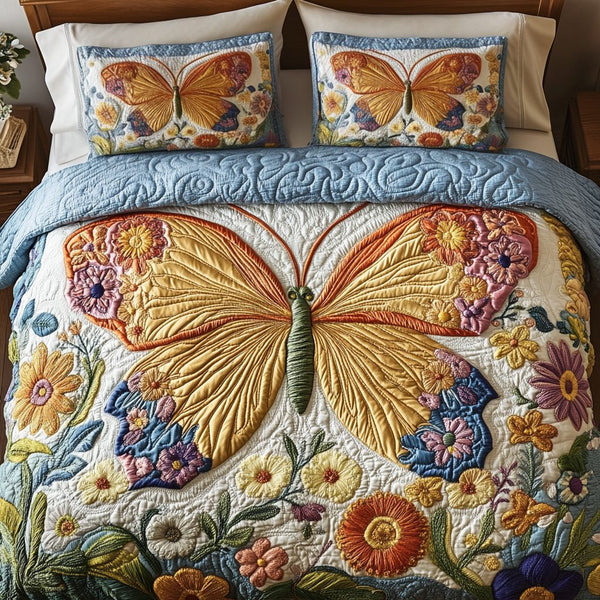Dreamy Butterfly Haven quilted 3-piece bedding set on a made bed with two matching pillow shams