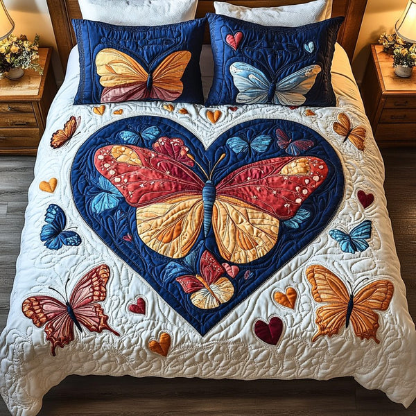 Dreamy Flight quilted 3-piece bedding set on a made bed with two matching pillow shams