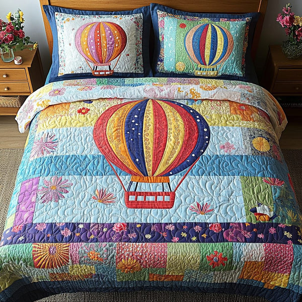 Dreamy Flight quilted 3-piece bedding set on a made bed with two matching pillow shams