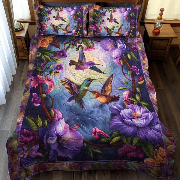 Dreamy Hummingbirds quilted 3-piece bedding set on a made bed with two matching pillow shams