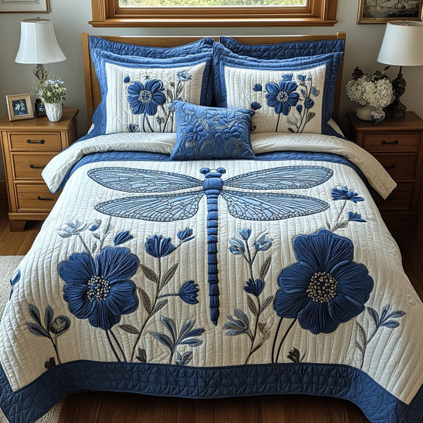 Drifting Wings quilted 3-piece bedding set on a made bed with two matching pillow shams