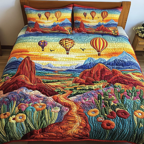Dune Journey quilted 3-piece bedding set on a made bed with two matching pillow shams