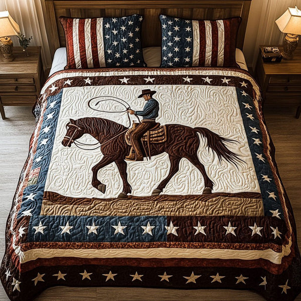 Dusty Trails quilted 3-piece bedding set on a made bed with two matching pillow shams