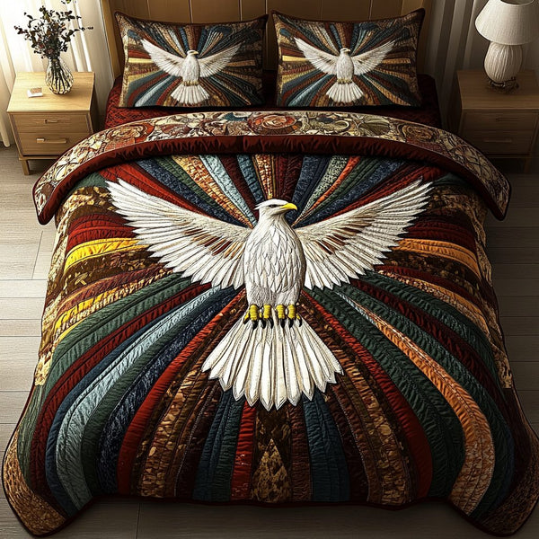 Eagle Spirit quilted 3-piece bedding set on a made bed in a warmly lit bedroom