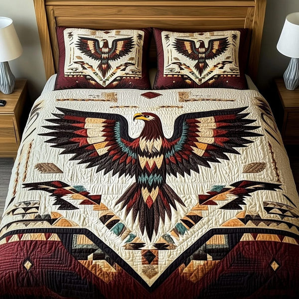 Eagles Flight quilted 3-piece bedding set on a made bed with two matching pillow shams