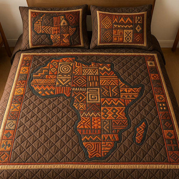 Earth Tone Africa quilted 3-piece bedding set on a made bed with two matching pillow shams