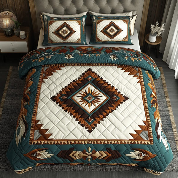 Earthly Essence quilted 3-piece bedding set on a made bed with two matching pillow shams