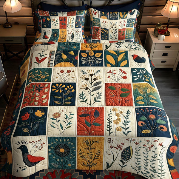 Earthy Petals quilted 3-piece bedding set on a made bed with two matching pillow shams