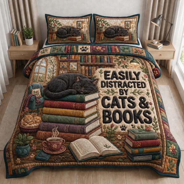 Easily Distracted By Cats & Books quilted 3-piece bedding set on a made bed with two matching pillow shams