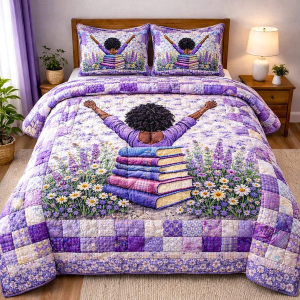 Ebony Glow quilted 3-piece bedding set on a made bed with two matching pillow shams