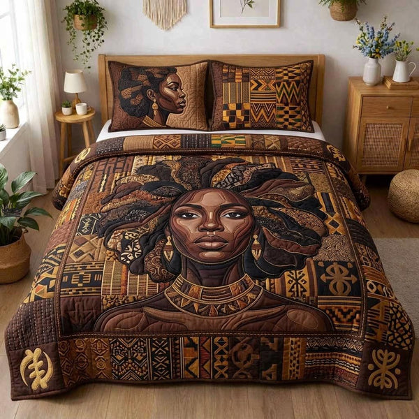 Ebony Queen quilted 3-piece bedding set on a made bed with two matching pillow shams