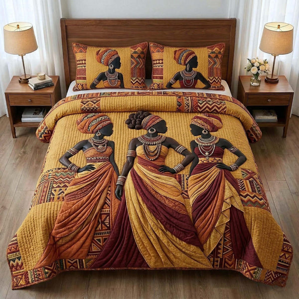 Ebony Queen quilted 3-piece bedding set on a made bed with two matching pillow shams