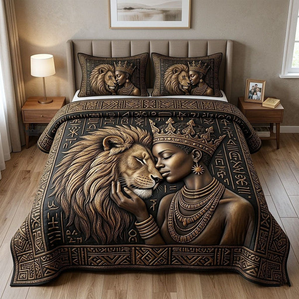 Ebony Queen quilted 3-piece bedding set on a made bed with two matching pillow shams