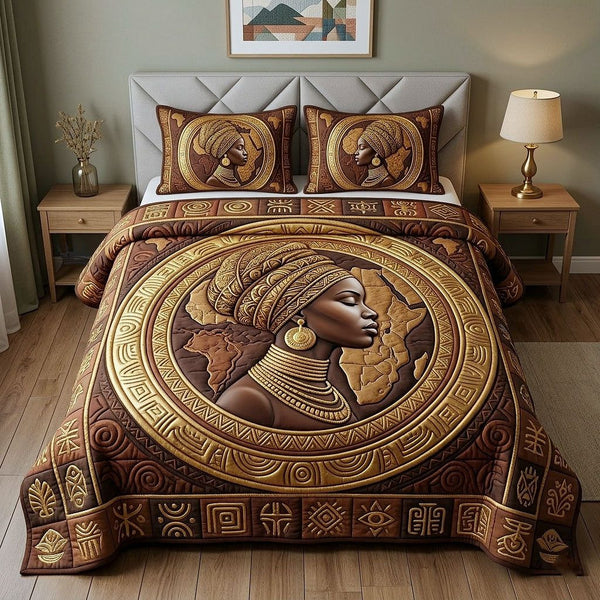 Ebony Queen quilted 3-piece bedding set on a made bed with two matching pillow shams