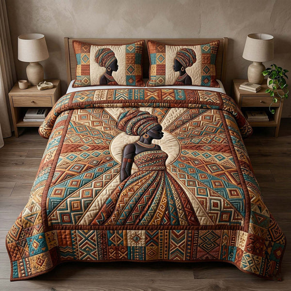 Ebony Queen quilted 3-piece bedding set on a made bed with two matching pillow shams