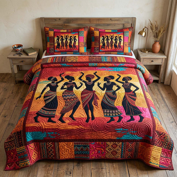 Ebony Queen quilted 3-piece bedding set on a made bed with two matching pillow shams