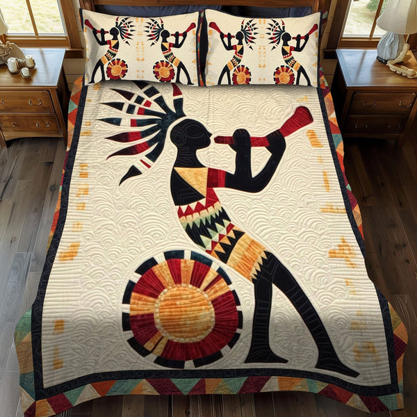Echo of Ancients quilted 3-piece bedding set on a made bed with two matching pillow shams