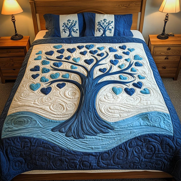 Eden Hearts quilted 3-piece bedding set on a made bed with two matching pillow shams