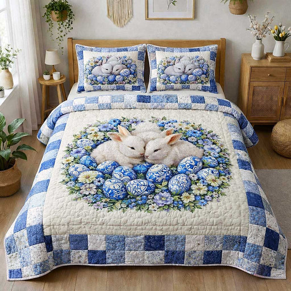 Egg Hunt quilted 3-piece bedding set on a made bed with two matching pillow shams