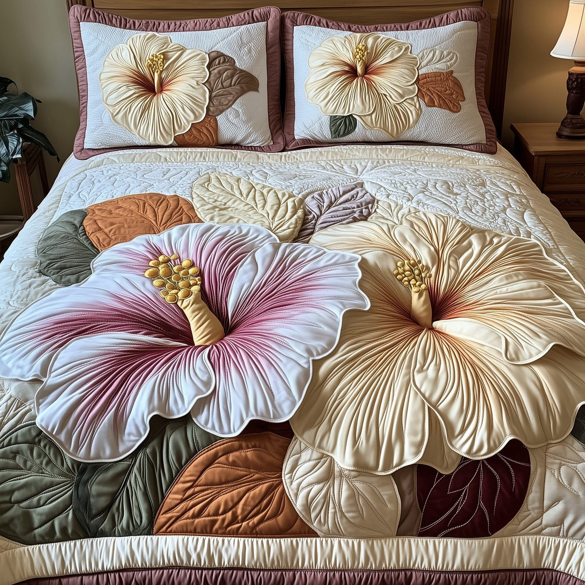 Elegance Hibiscus Heaven quilted 3-piece bedding set on a made bed in a softly lit bedroom