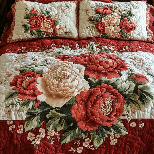 Elegant Bloom quilted 3-piece bedding set on a made bed with two matching pillow shams