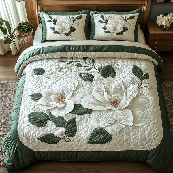 Elegant Blooming Magnolia quilted 3-piece bedding set on a made bed with two matching pillow shams