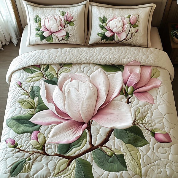 Elegant Blooming Magnolia quilted 3-piece bedding set on a made bed with two matching pillow shams