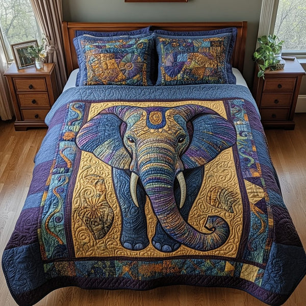 Elegant Elephant quilted 3-piece bedding set on a made bed with two matching pillow shams