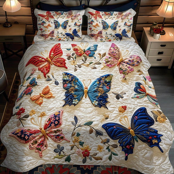 Elegant Flutter Haven quilted 3-piece bedding set on a made bed with two matching pillow shams
