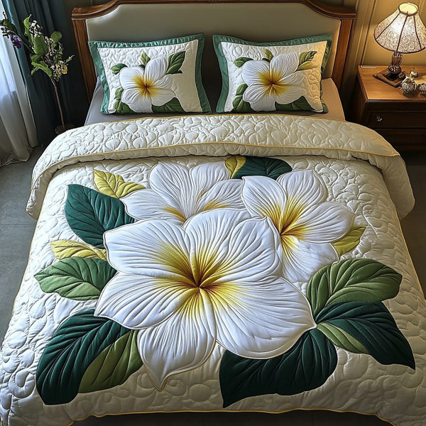 Elegant Petals quilted 3-piece bedding set on a made bed with two matching pillow shams