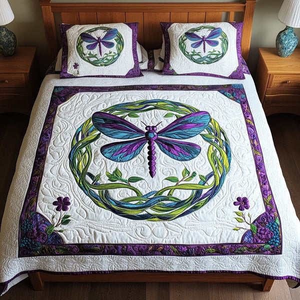 Elegant Vines quilted 3-piece bedding set on a made bed with two matching pillow shams