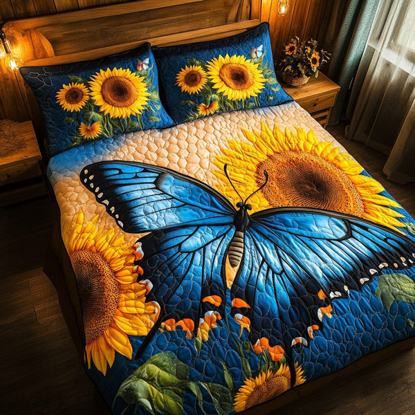 Elegant Wings quilted 3-piece bedding set on a made bed with two matching pillow shams