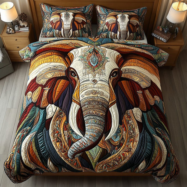 Elephant Essence quilted 3-piece bedding set on a made bed with two matching pillow shams