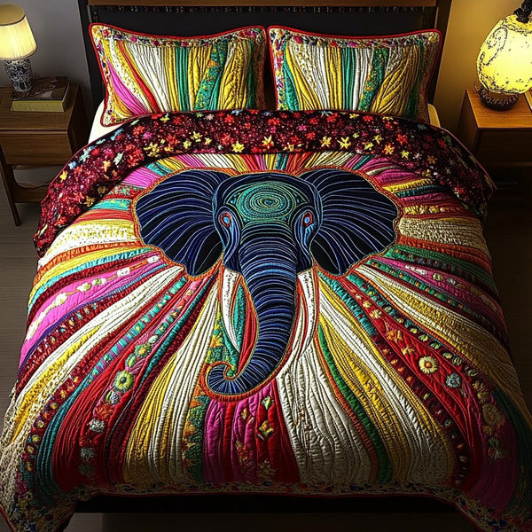 Elephant Grace quilted 3-piece bedding set on a made bed with two matching pillow shams